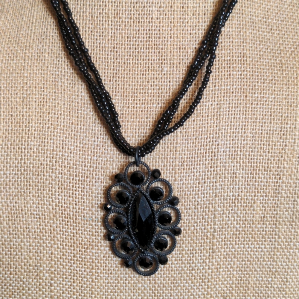NY three strand black bead with pendant necklace
